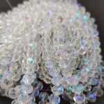 Firepolished donut bead - 5x6mm - Crystal AB - sold on strand